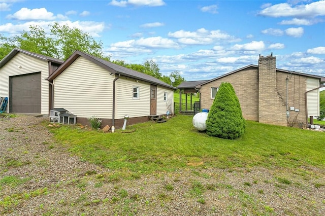 512 Leckrone Highhouse Rd, Pa, PA 15458 - view of home's exterior featuring entry steps, a yard, a garage, and a chimney
