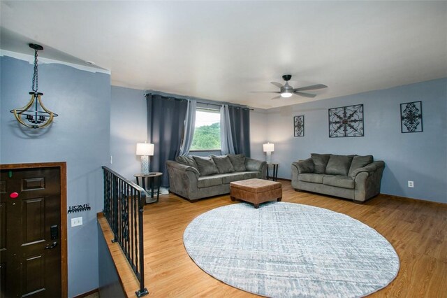 512 Leckrone Highhouse Rd, Pa, PA 15458 - living area with wood finished floors, a ceiling fan, baseboards, and a chandelier