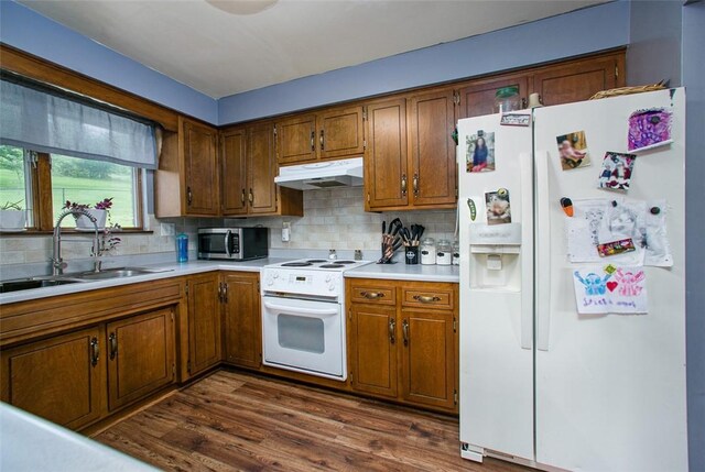 512 Leckrone Highhouse Rd, Pa, PA 15458 - kitchen with white appliances, a sink, under cabinet range hood, light countertops, and tasteful backsplash