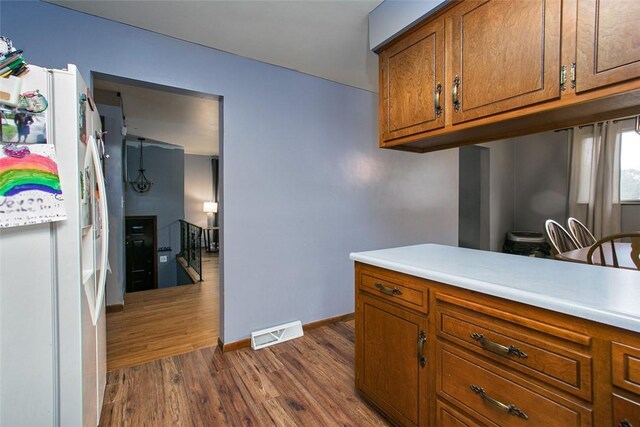 512 Leckrone Highhouse Rd, Pa, PA 15458 - kitchen featuring white fridge with ice dispenser, brown cabinetry, dark wood-style floors, and light countertops