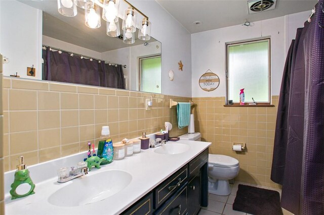 512 Leckrone Highhouse Rd, Pa, PA 15458 - full bathroom featuring tile walls, tile patterned flooring, toilet, double vanity, and a chandelier
