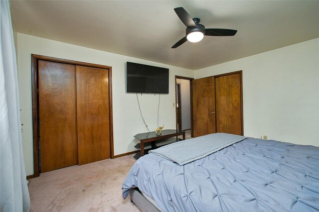 512 Leckrone Highhouse Rd, Pa, PA 15458 - bedroom with light colored carpet, multiple closets, a ceiling fan, and baseboards