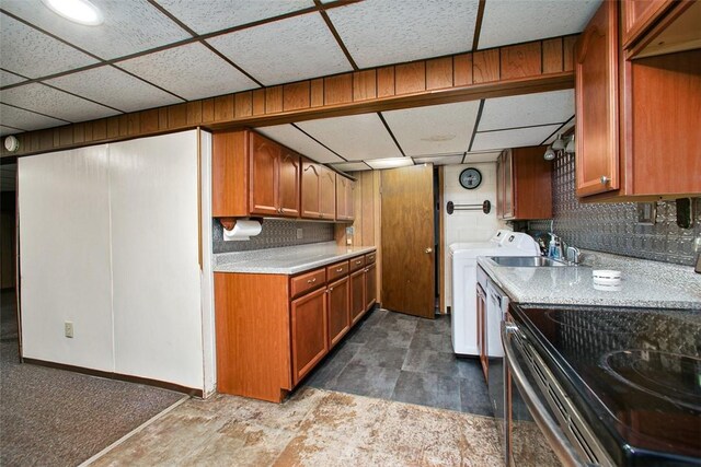 512 Leckrone Highhouse Rd, Pa, PA 15458 - kitchen with electric stove, a paneled ceiling, light countertops, brown cabinets, and washer and dryer