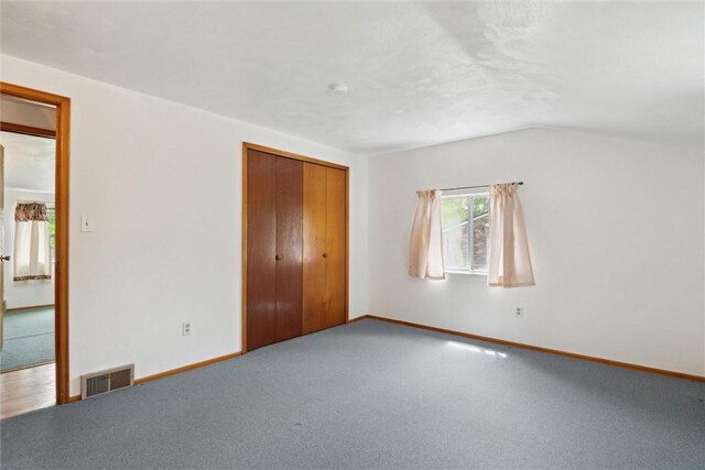 1777 Oblock Rd, Plum Boro, PA 15239 - unfurnished bedroom with baseboards, lofted ceiling, carpet, and a closet
