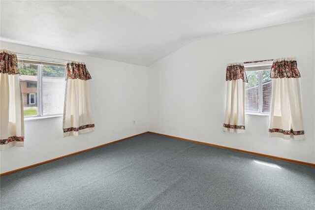 1777 Oblock Rd, Plum Boro, PA 15239 - spare room featuring carpet floors, lofted ceiling, healthy amount of natural light, and baseboards