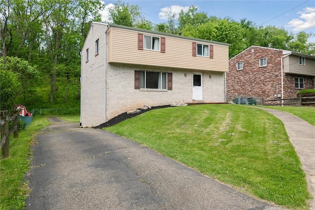 1777 Oblock Rd, Plum Boro, PA 15239 - colonial inspired home with brick siding and asphalt driveway