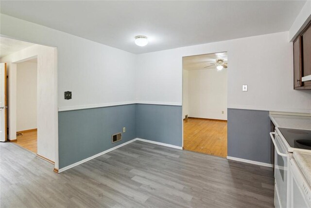1777 Oblock Rd, Plum Boro, PA 15239 - kitchen with white electric range, wood finished floors, ceiling fan, baseboards, and light countertops