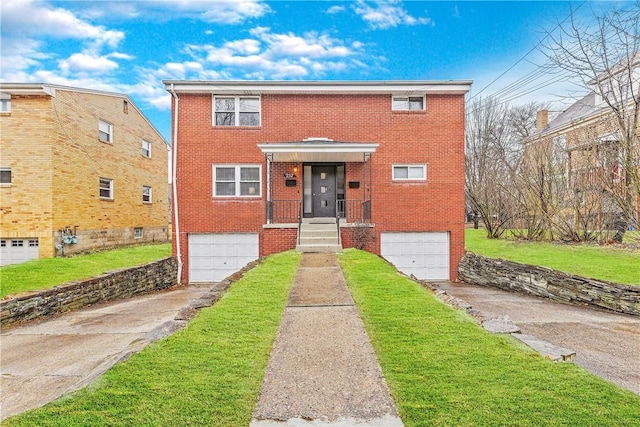 257 Noble Ave, Crafton, PA 15205 - view of front of home with concrete driveway, a garage, brick siding, and a front yard