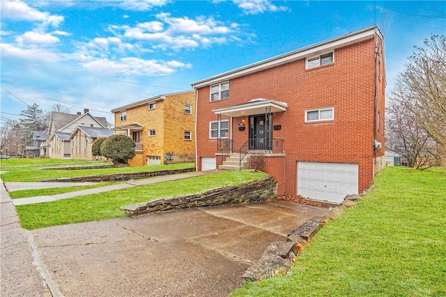 257 Noble Ave, Crafton, PA 15205 - view of front facade featuring a garage, concrete driveway, a front lawn, and brick siding