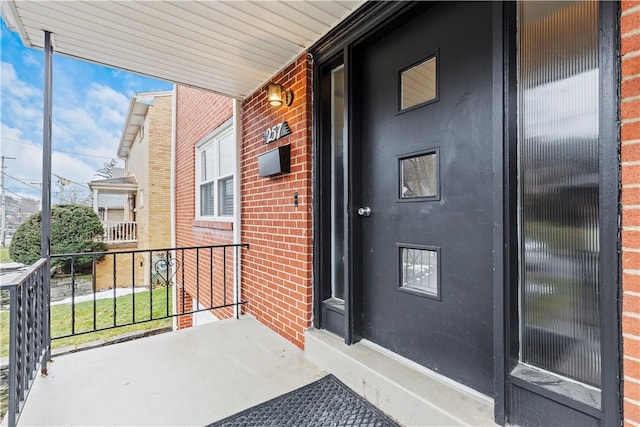 257 Noble Ave, Crafton, PA 15205 - doorway to property with brick siding and covered porch