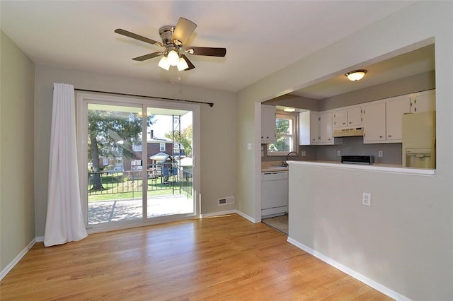 257 Noble Ave, Crafton, PA 15205 - kitchen featuring under cabinet range hood, white appliances, white cabinetry, light wood-type flooring, and a ceiling fan