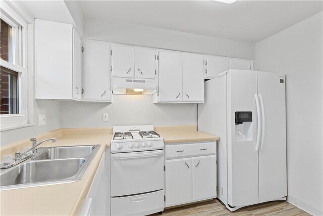 257 Noble Ave, Crafton, PA 15205 - kitchen with white appliances, under cabinet range hood, a sink, white cabinets, and light wood-style flooring