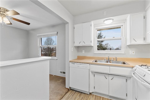 257 Noble Ave, Crafton, PA 15205 - kitchen with white appliances, light countertops, a sink, a ceiling fan, and white cabinets