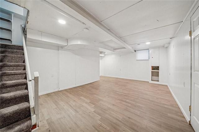 1422 Meadow St, Mckeesport, PA 15132 - finished basement with wood finished floors, stairway, baseboards, and recessed lighting