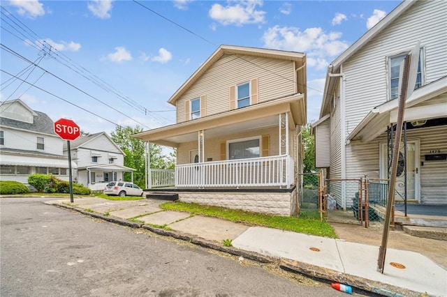 1422 Meadow St, Mckeesport, PA 15132 - view of front facade with a porch and a gate