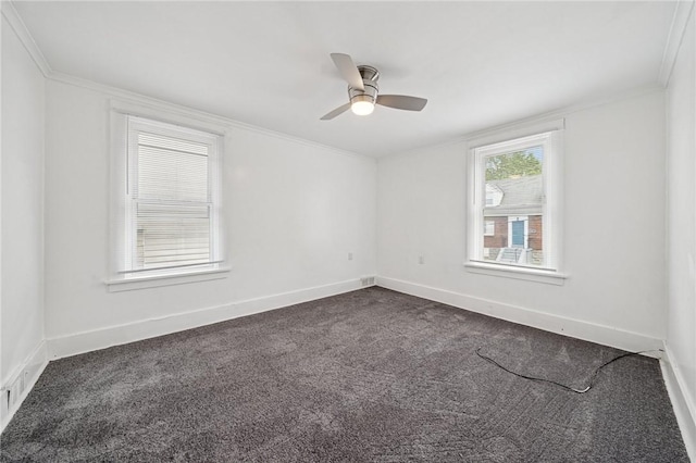 1422 Meadow St, Mckeesport, PA 15132 - empty room featuring ornamental molding, a ceiling fan, dark colored carpet, and baseboards