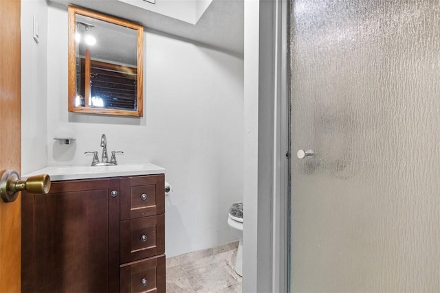 830 W Pike St, Chartiers, PA 15342 - bathroom featuring vanity, toilet, and a shower with door