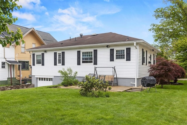 830 W Pike St, Chartiers, PA 15342 - rear view of house featuring a garage, a yard, and a patio area