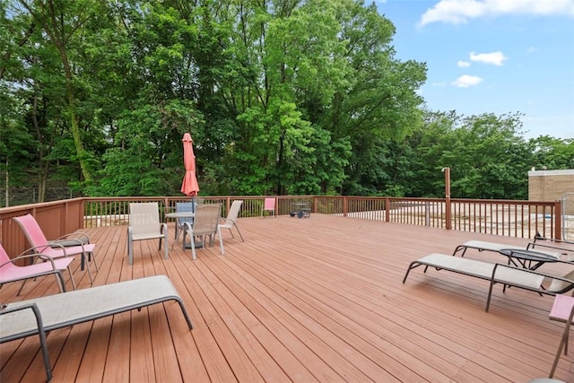 5100 5th Ave Unit 407, Shadyside, PA 15232 - wooden deck with outdoor dining space and view of scattered trees