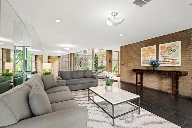 5100 5th Ave Unit 407, Shadyside, PA 15232 - living area featuring a wall of windows, brick wall, and recessed lighting