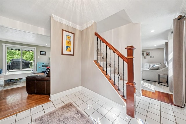 282 Carmell Dr, Upper St Clair, PA 15241 - staircase featuring tile patterned floors, crown molding, baseboards, and a textured ceiling