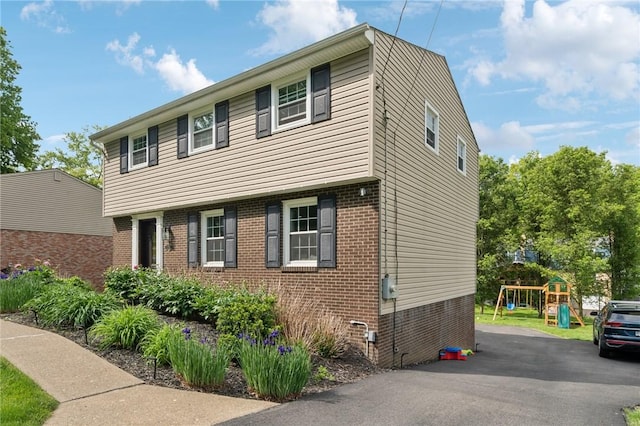 282 Carmell Dr, Upper St Clair, PA 15241 - colonial inspired home with brick siding and a playground