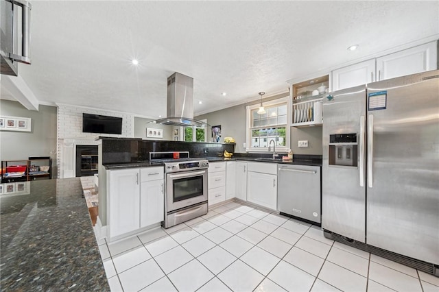 282 Carmell Dr, Upper St Clair, PA 15241 - kitchen featuring appliances with stainless steel finishes, island range hood, a sink, open floor plan, and white cabinets