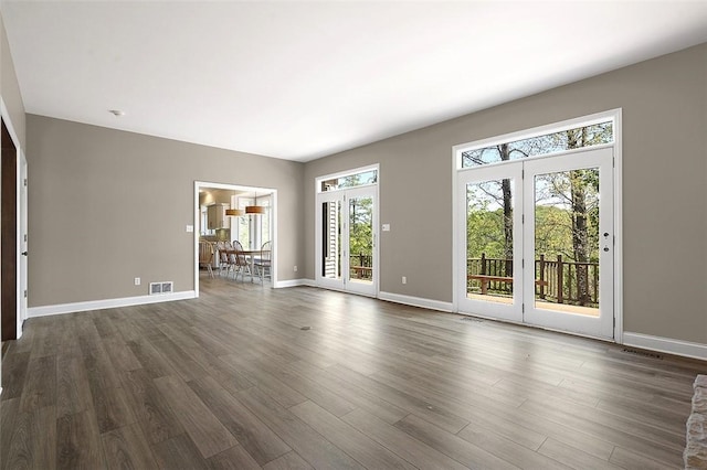 3702 Millstone Ct, Murrysville, PA 15668 - unfurnished living room with dark wood-type flooring and baseboards