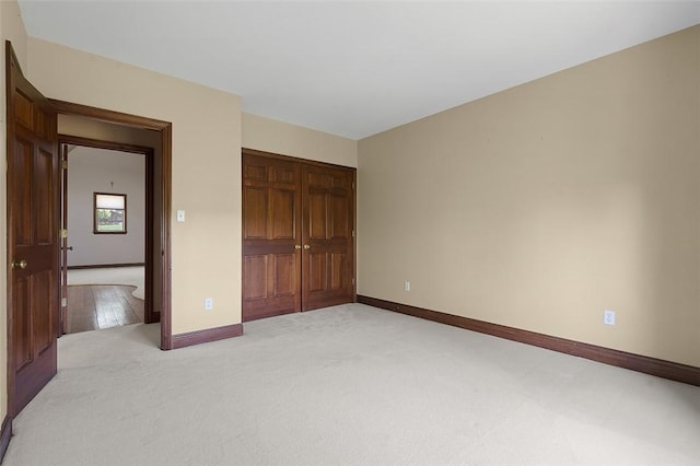 3702 Millstone Ct, Murrysville, PA 15668 - unfurnished bedroom featuring a closet, light carpet, and baseboards