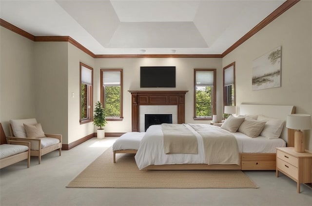 3702 Millstone Ct, Murrysville, PA 15668 - carpeted bedroom featuring multiple windows, a tiled fireplace, a tray ceiling, crown molding, and baseboards