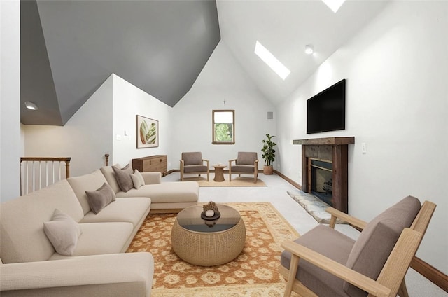 3702 Millstone Ct, Murrysville, PA 15668 - living room with a skylight, high vaulted ceiling, a fireplace with raised hearth, baseboards, and light carpet