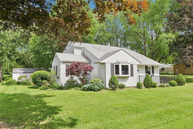 211 Homestead Dr, Middlesex Twp, PA 16059 - view of front of property featuring a front lawn, a shingled roof, and board and batten siding