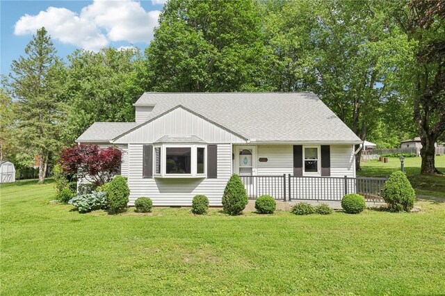 211 Homestead Dr, Middlesex Twp, PA 16059 - view of front of house with covered porch, roof with shingles, and a front lawn