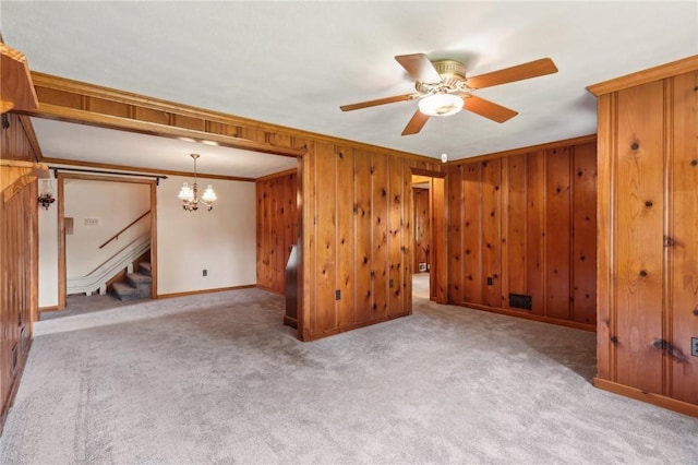 211 Homestead Dr, Middlesex Twp, PA 16059 - spare room featuring ornamental molding, a ceiling fan, a chandelier, stairs, and carpet floors