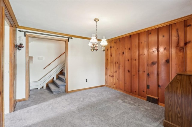 211 Homestead Dr, Middlesex Twp, PA 16059 - empty room with a chandelier, stairs, baseboards, carpet flooring, and crown molding