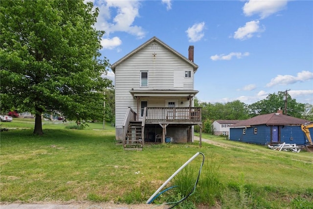 920 W 4th Ave, Derry Twp, PA 15627 - back of property with stairs, a deck, a chimney, and a yard