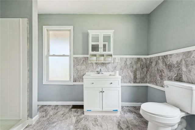 920 W 4th Ave, Derry Twp, PA 15627 - bathroom with toilet, marble finish flooring, vanity, a wainscoted wall, and a shower