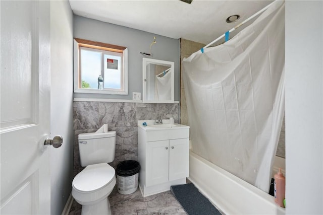 920 W 4th Ave, Derry Twp, PA 15627 - full bathroom with tile walls, toilet, shower / tub combo, and vanity