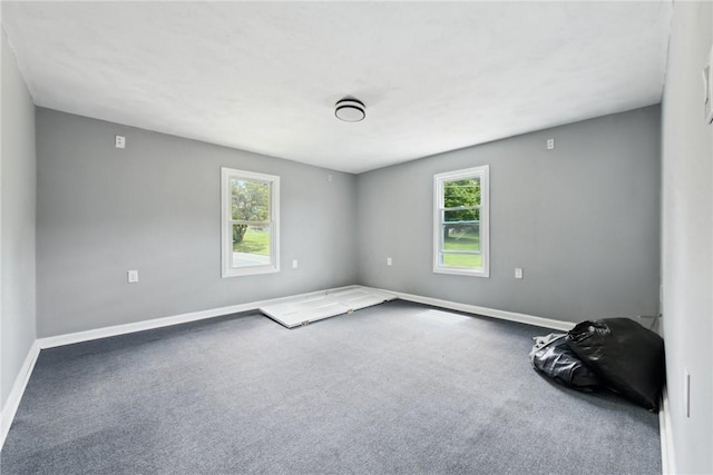 920 W 4th Ave, Derry Twp, PA 15627 - carpeted empty room featuring plenty of natural light and baseboards