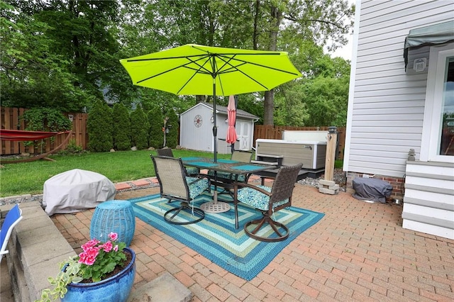 120 S Shenango St, Mercer Boro Mer, PA 16137 - view of patio featuring a hot tub, outdoor dining space, and view of wooded area