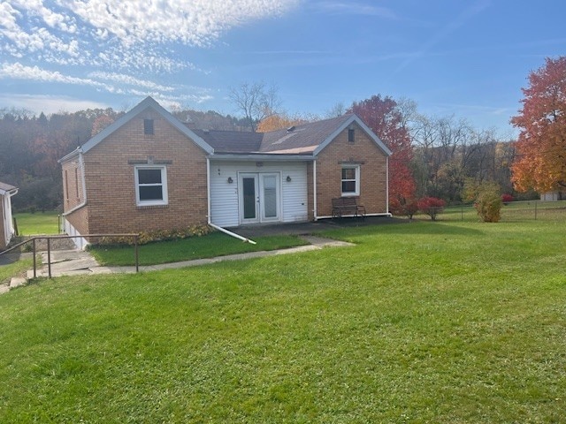 525 Glade Mill Run, Middlesex Twp, PA 16059 - back of property featuring french doors, brick siding, and a lawn