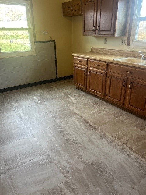 525 Glade Mill Run, Middlesex Twp, PA 16059 - kitchen featuring light countertops, a sink, and brown cabinetry
