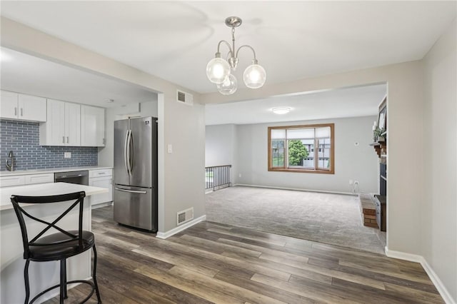 362 Fruitwood Dr, Bethel Park, PA 15102 - kitchen with freestanding refrigerator, light countertops, white cabinetry, and dark wood-type flooring