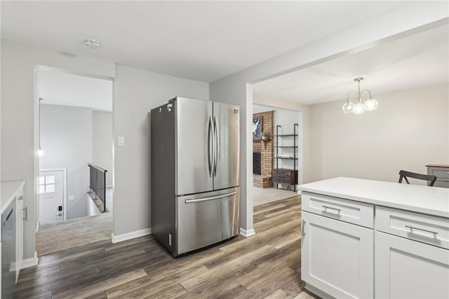 362 Fruitwood Dr, Bethel Park, PA 15102 - kitchen featuring freestanding refrigerator, white cabinetry, wood finished floors, and light countertops