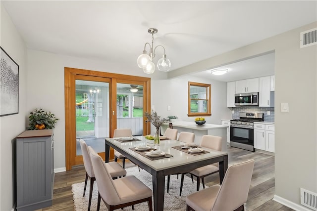362 Fruitwood Dr, Bethel Park, PA 15102 - dining area featuring light wood finished floors, a chandelier, a ceiling fan, and baseboards