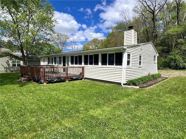 11859 Kammerer Ave, Conneaut Lake Cra, PA 16316 - rear view of house featuring a deck, a chimney, and a yard