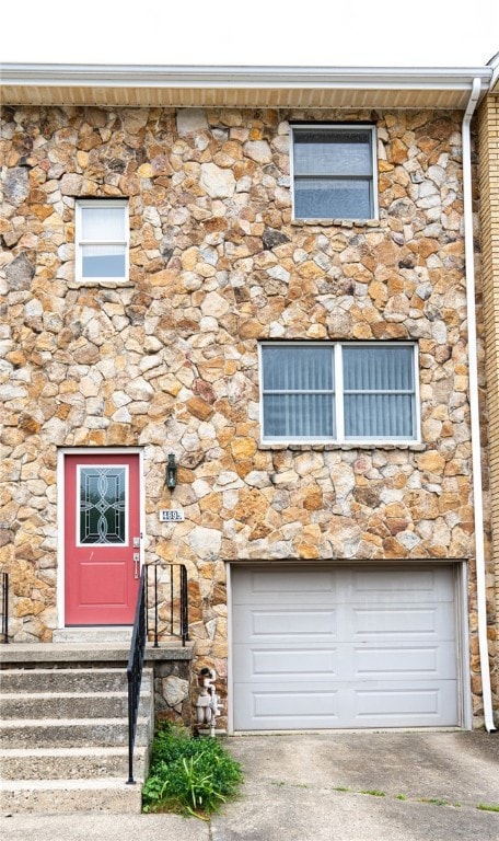 4895 Lucerne Rd, White Twp Ind, PA 15701 - townhome / multi-family property with stone siding and an attached garage