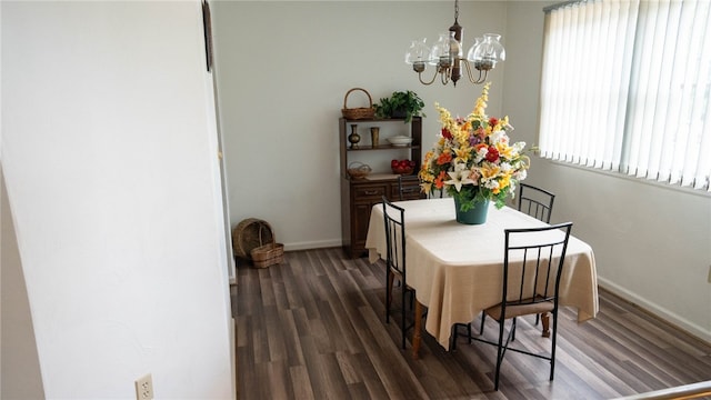 4895 Lucerne Rd, White Twp Ind, PA 15701 - dining area featuring a chandelier, dark wood finished floors, and baseboards