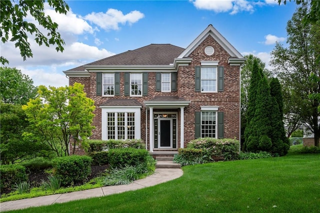 2214 Shannon Mills Dr, Connoquenessing Twp, PA 16053 - georgian-style home with a front lawn, brick siding, and a shingled roof