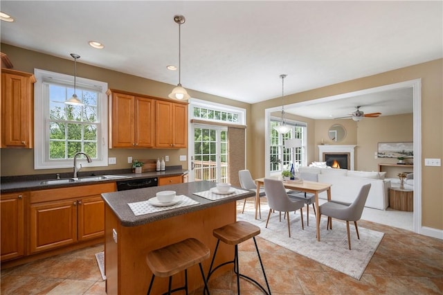 2214 Shannon Mills Dr, Connoquenessing Twp, PA 16053 - kitchen with a sink, dark countertops, healthy amount of natural light, a center island, and recessed lighting